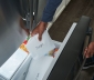 Man placing wrapped meat into freezer paper