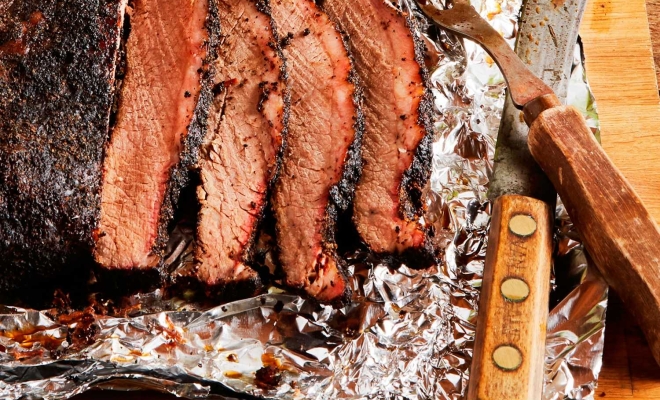 Meat on a table with a knife