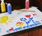 Kids painting on freezer paper