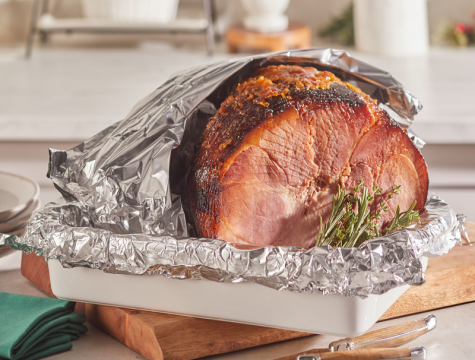 cooked ham wrapped in Reynolds Wrap foil